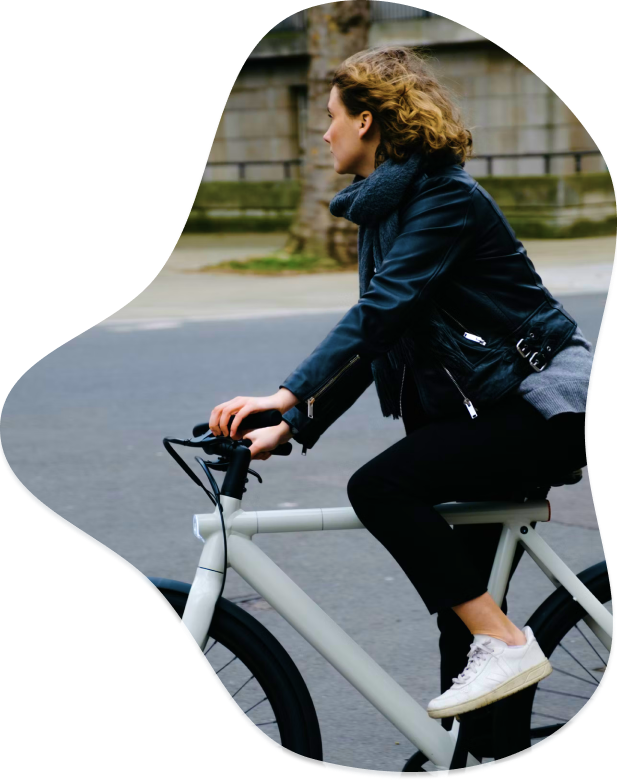 Woman cycling VanMoof e-bike